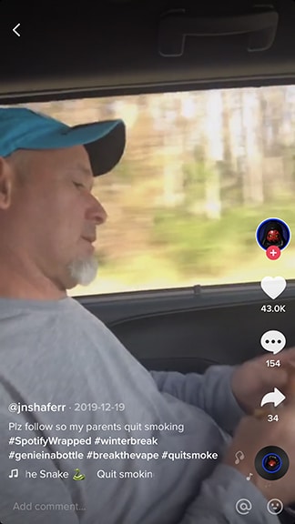 A man wearing a blue cap sits in a car seat, looking down; the TikTok interface and captions overlay the image, emphasizing its connection to trending content.