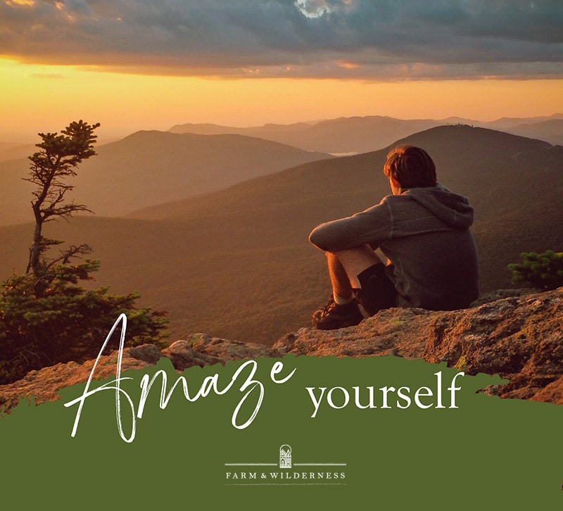 Person sitting on a mountain at sunset, with "Amaze yourself" and "Farm & Wilderness" written on the image, perfect for a Summer Camp Ad Campaign.
