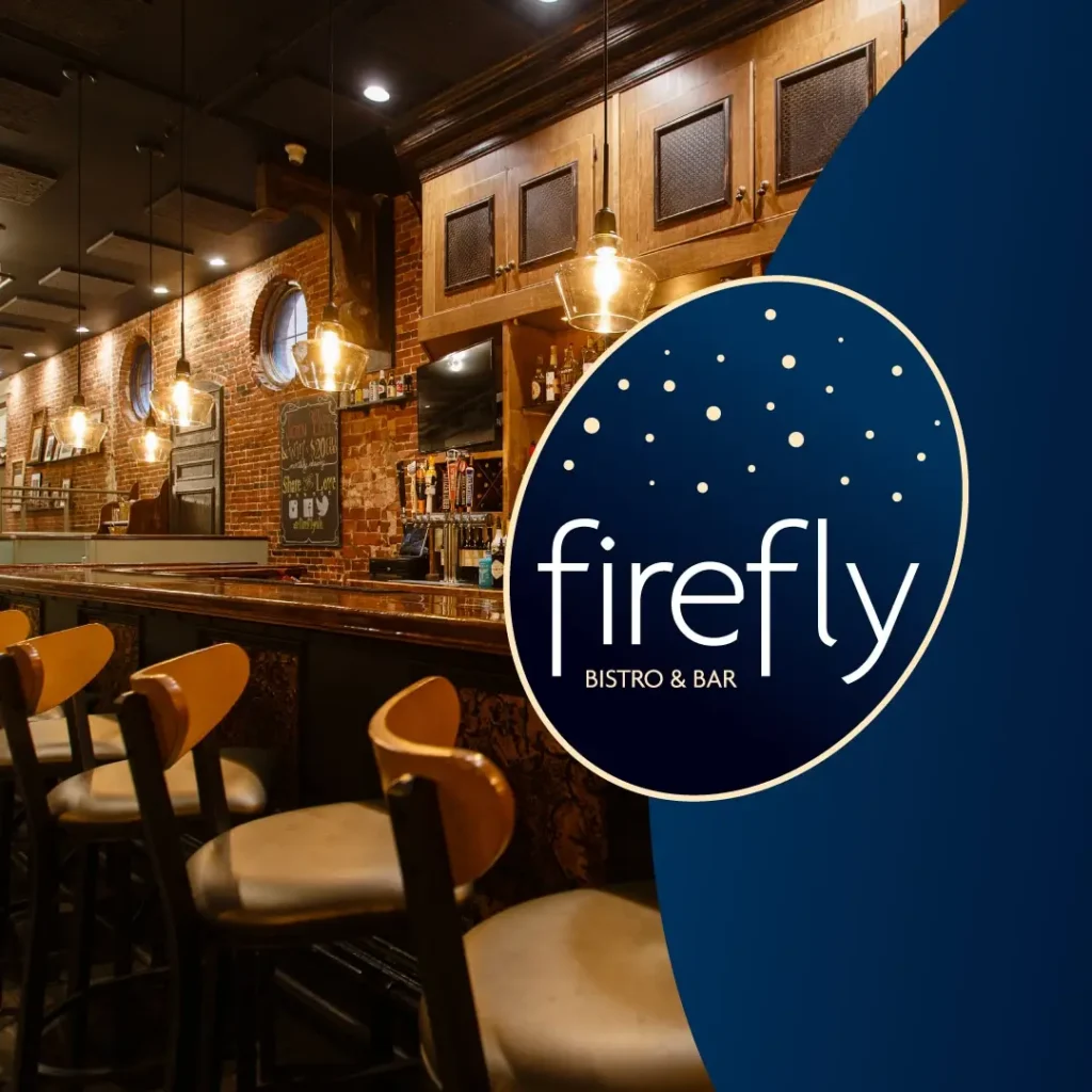 A cozy bar with wooden chairs and warm lighting, featuring the Firefly Bistro & Bar logo on a blue background.