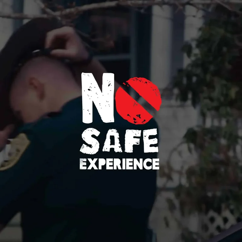 A police officer adjusts their hat; overlaid text reads No Safe Experience with a red slash through No, creating a striking marketing visual.