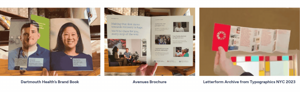 Three hands each hold open different print materials: a brand book, a brochure, and a folded archive leaflet.