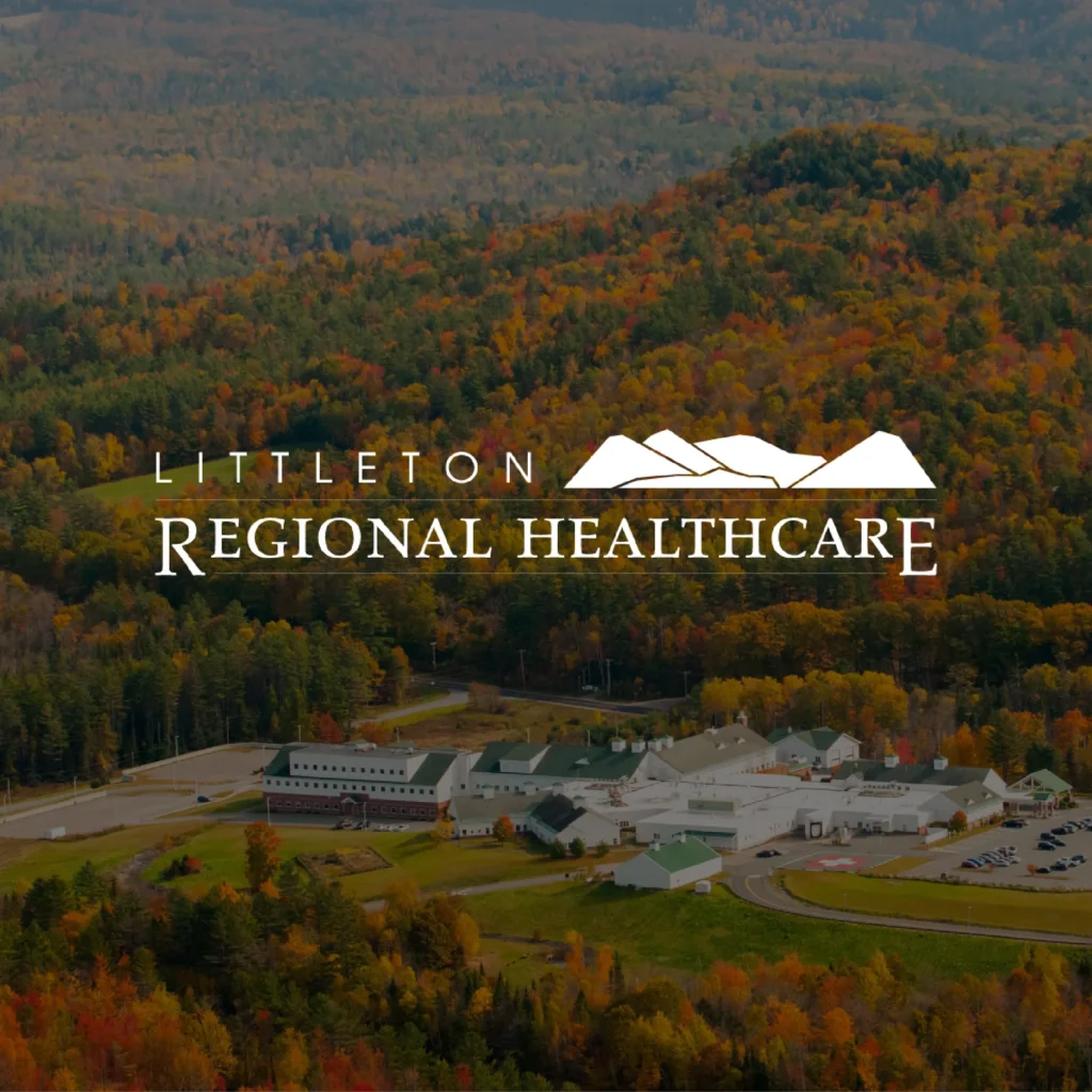 Littleton Regional Healthcare logo over an aerial view of a hospital complex surrounded by autumn forests.